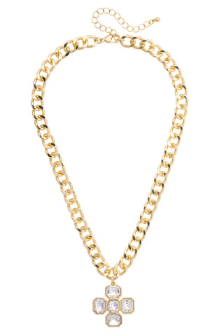 Gold chain necklace with a hexagonal pendant on a white background