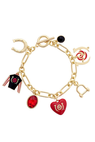 Gold charm bracelet with various charms on a white background