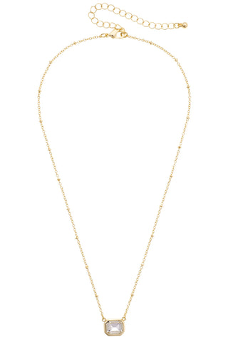 A delicate gold chain necklace with a small square bezel-set clear gemstone pendant, displayed on a clean white background.