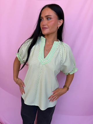 woman wearing a green top