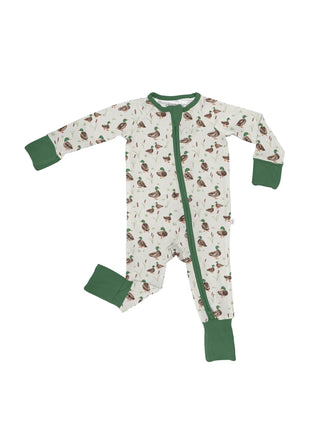 A baby long-sleeve footed sleeper with an all-over duck print on an off-white background, featuring solid green cuffs, collar, and zipper trim.