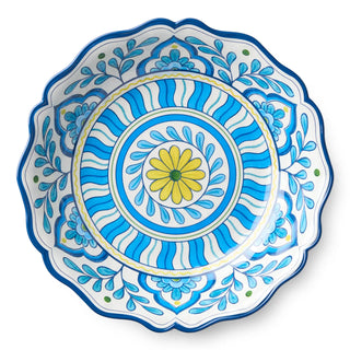 Decorative plate with blue and white floral patterns and a yellow center on a white background