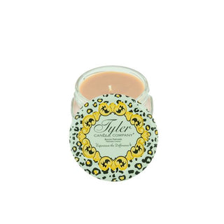 Candle in a decorative tin with a leopard print design on a white background