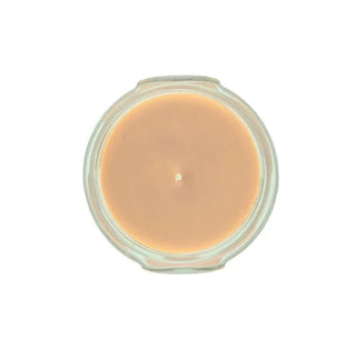 Jar of yellow candle on a white background