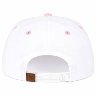 White cap with pink buttons on a white background