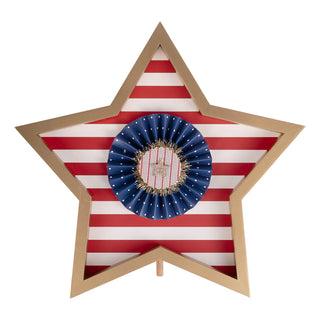 Star-shaped decorative item with American flag design and central wreath on a white background