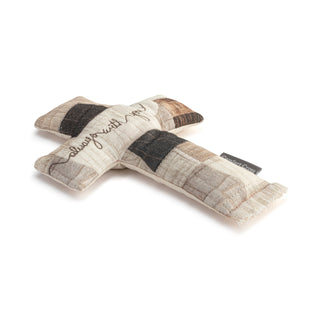Patchwork-style pillow with striped pattern on a white background