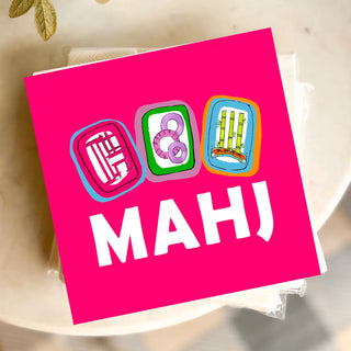 Pink card with colorful card game symbols and 'MAHJ' text on a blurred background