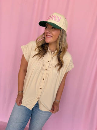 girl wearing a beige top