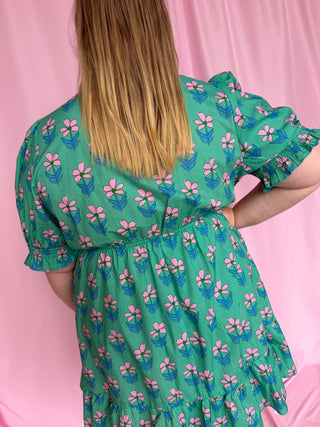 woman wearing a short floral dress 
