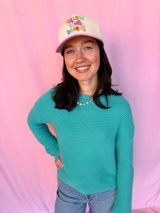 woman wearing a blue sweater 