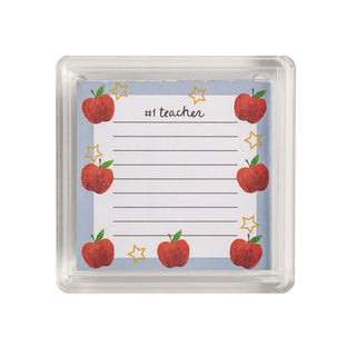 A square clear plastic case containing a teacher-themed notepad with red apples, gold stars, and the text '#1 teacher' on a light blue background.