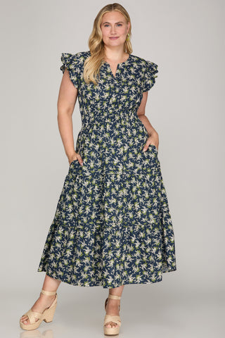 Woman wearing a floral dress on a gray background