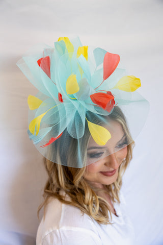 Woman wearing a colorful headpiece with a white background