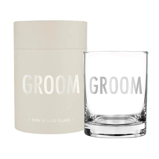 Clear glass with 'GROOM' text and beige container on a white background