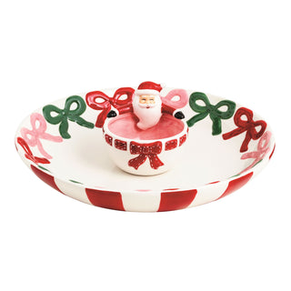 Decorative ceramic plate with Santa Claus and bows on a white background