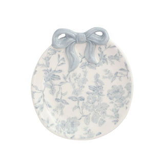 Decorative round plate with floral pattern and blue bow on a white background
