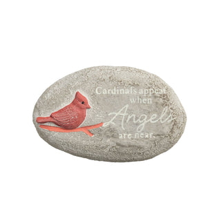 Decorative stone with a red cardinal bird and text on a white background