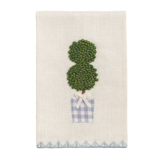 Decorative towel with a green topiary design and blue checkered pot on a white background
