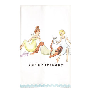 A white kitchen towel featuring an illustration of three women in vintage dresses holding wine glasses, with the text 'GROUP THERAPY' printed below. The towel has a light blue scalloped border at the bottom.