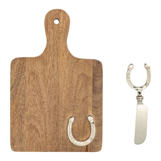 Wooden cutting board with a horseshoe hook and a white knife on a white background