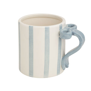 White mug with blue stripes and handle on a white background