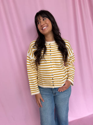 girl wearing a striped cardigan