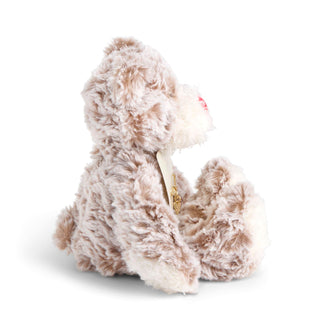 Fluffy beige and white plush toy on a white background