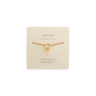 Gold bracelet with heart charm on a Demdaco branded card