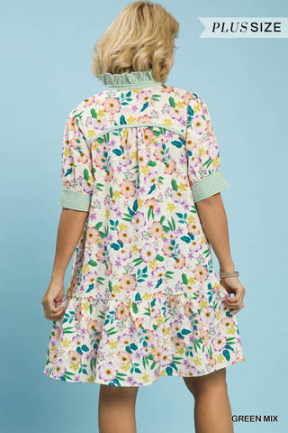 Woman wearing a floral dress with a blue background