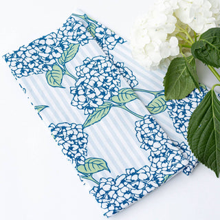 Two floral-patterned notebooks with white hydrangeas on a white background