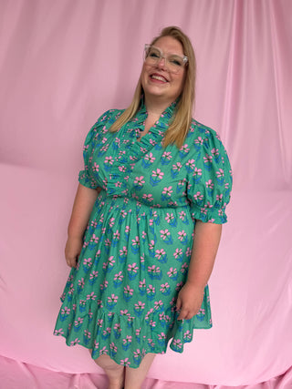 woman wearing a short floral dress 