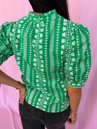 woman wearing green top 