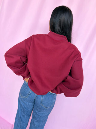 woman wearing a mockneck 