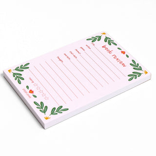 Notepad with decorative border and text on a white background