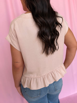 girl wearing a pink top