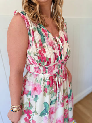 Woman wearing a floral dress with a white background