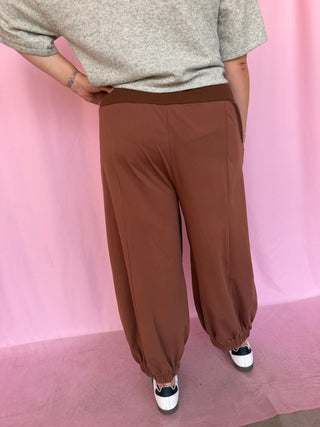 girl wearing brown pants