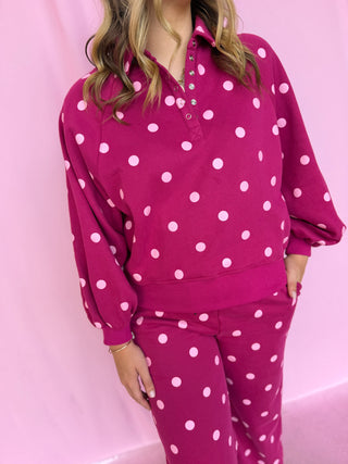 girl wearing a polka dot set 