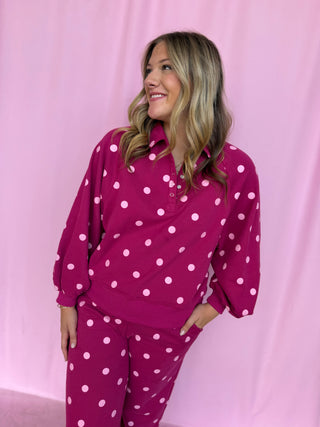 girl wearing a polka dot set 