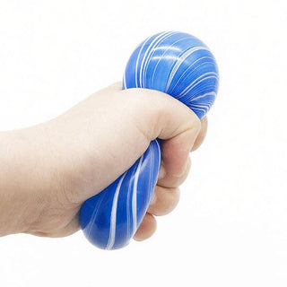 A hand squeezing a blue and white marbled stress ball against a plain white background.