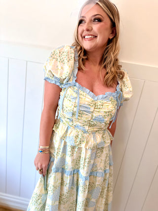 Woman wearing a floral dress with a white background