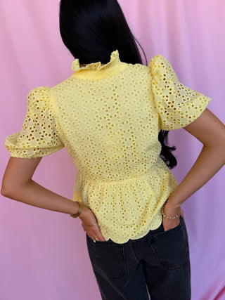 woman wearing a yellow top