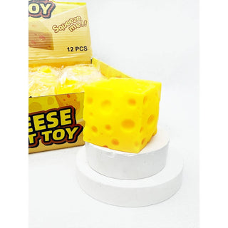 Yellow cheese toy with packaging labeled 'Squeeze me!' on a white background