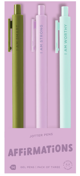 Set of three affirmation pens on a pink packaging with text 'I AM STRONG', 'I AM WORTHY', and 'I AM SMART'.