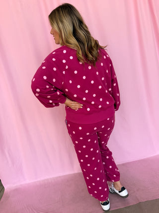 girl wearing a polka dot set 