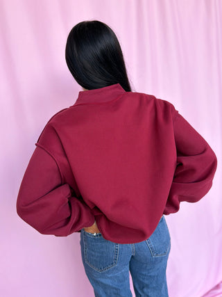 woman wearing a mockneck 