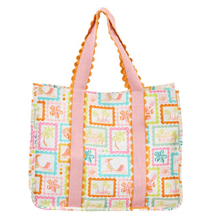 Colorful tote bag with patterned design and pink handles on a white background