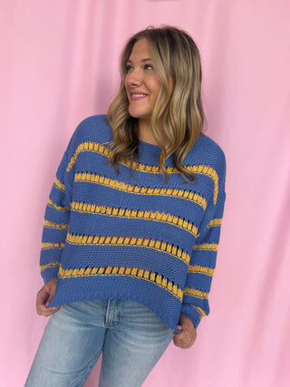 girl wearing a striped sweater 