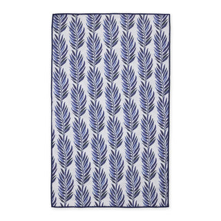 Navy leaf patterned towel on a white background